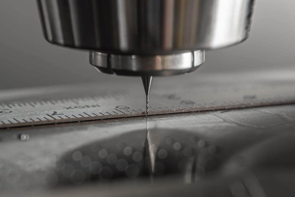 Precision cutting tool machining a metal workpiece to close tolerance
